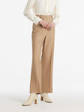 A lady wears straight pants to the interview.